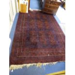 A MAROON AND BLUE GROUND CARPET, approximate size 300cm x 206cm