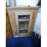 A PINE GLAZED HANGING CORNER CUPBOARD