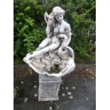 A PAINTED COMPOSITE WATER FEATURE OF A SEMI CLAD WOMAN, with a swan on separate pillar base (sd)