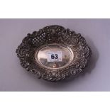 A PIERCED AND MOULDED SILVER OVAL BON BON DISH, having floral and scroll decoration to pierced