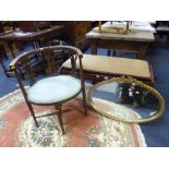 A GILT FRAMED OVAL WALL MIRROR, and an Edwardian inlaid tub style chair (sd)