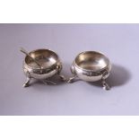 A PAIR OF OPEN CIRCULAR SALTS, having shell mounts to hoof feet, beaded rim to body, London 1862