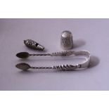 A NOVELTY MINIATURE SILVER WHISTLE, with embossed scroll decoration, silver sugar tongs having