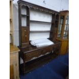 A 19TH CENTURY OAK DRESSER, the plate rack with small cupboards and drawers above three drawers