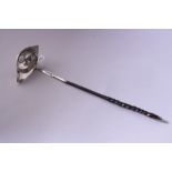 A SILVER TODDY SPOON, monogrammed JEH with George II coin, London 1792, on twisted handle,