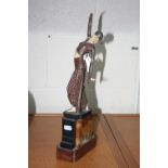 AN ART DECO STYLE FIGURINE, on stepped marble base, (after Chiparus), height approximately 41cm