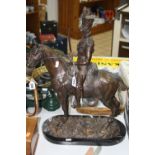 A BRONZE EFFECT STUDY, French soldier on horseback, on naturalistic oval base on marble plinth,