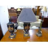 A PAIR OF EBONISED URN SHAPED TABLE LAMPS, with crest detail (one shade only) and another table lamp