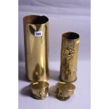 FOUR PIECES OF WWI ERA TRENCH ART, fashioned from brass shell cases, two small end caps made into