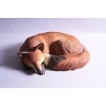 A BORDER FINE ARTS FIRESIDE FOX, lying, A5890