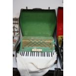 A CASED HOHNER PIANO ACCORDION, 'Virtuola III', in green