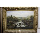 A GILT FRAMED LANDSCAPE PORTRAIT, bridge over river with waterfall, oil on canvas, unsigned,