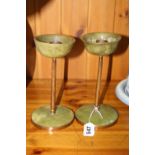 A PAIR OF BOWENITE CANDLESTICKS, the circular copper bound bases under tapering copper support