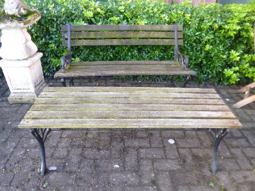 AN IRON SLATTED GARDEN BENCH, and a matching table (2)