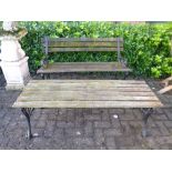AN IRON SLATTED GARDEN BENCH, and a matching table (2)