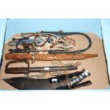 A BOX CONTAINING A NUMBER OF TOURIST STYLE EASTERN KNIVES, DAGGERS, (4), together with a US M1917,