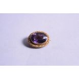 A 9CT LARGE AMETHYST SET BROOCH, approximate size 3.3cm x 2.8cm