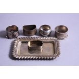 A MIXED LOT OF SILVER, to include a pin tray and five napkin rings, approximate weight 207 grams (