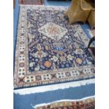 A BLUE AND OATMEAL GROUND CARPET, approximate size 276cm x 182cm