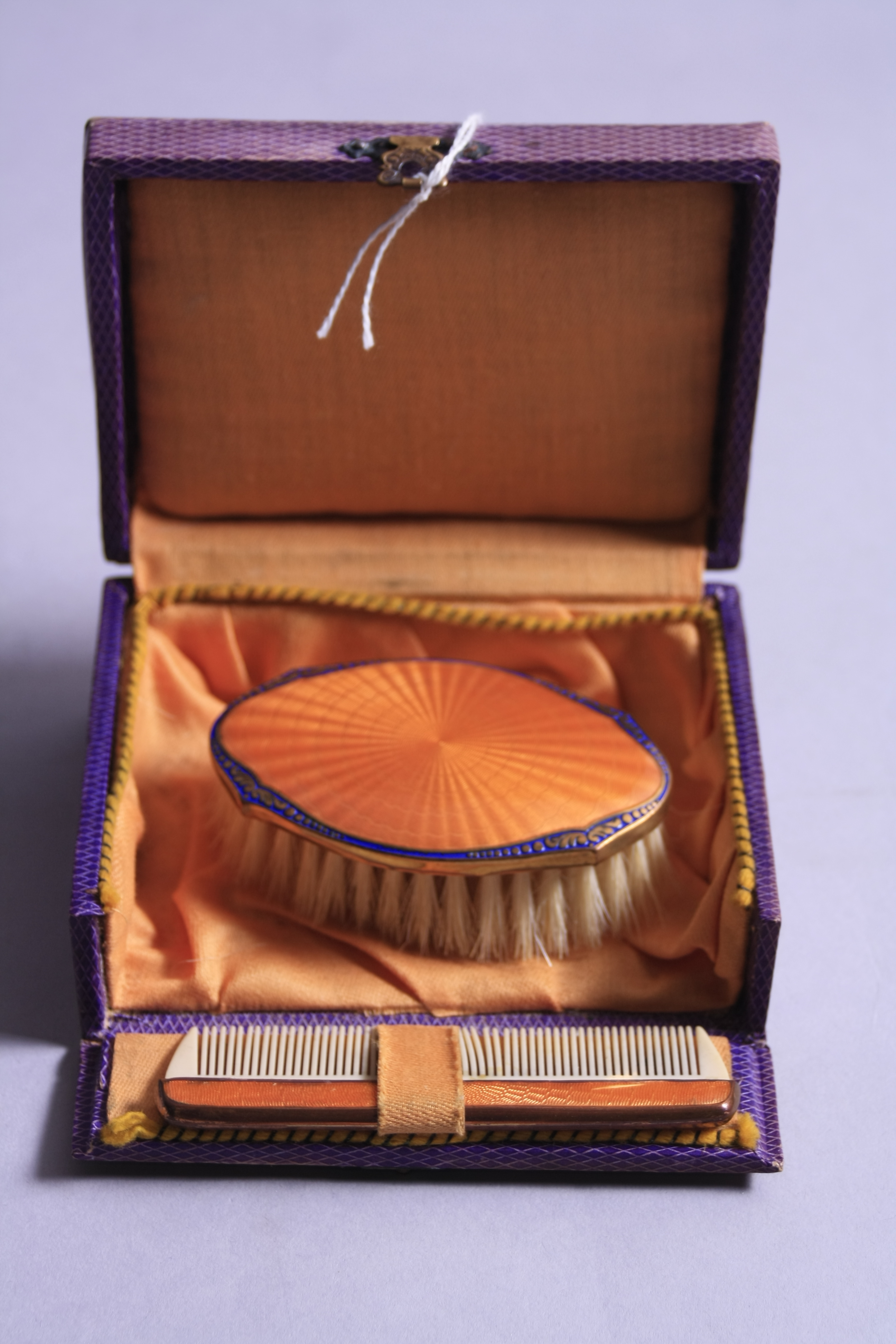 AN ENAMEL CHILD'S BRUSH AND COMB, in original box