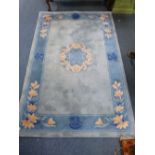 A CHINESE BLUE GROUND RUG, approximate size 185cm x 122cm