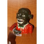 A TINPLATE NOVELTY 'JOLLY' MONEY BOX