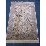 AN IVORY GROUND CASHMERE RUG, with floral design, approximate size 170cm x 120cm