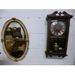 A PRESIDENT 30 DAY WALL CLOCK, and a wall mirror (2)