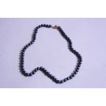 A HEMATITE NECKLACE, on a 9ct clasp, approximate length 45cm