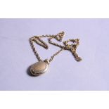 A 9CT LOCKET ON A 9CT CHAIN, approximate length 45cm, approximate weight 13.2 grams