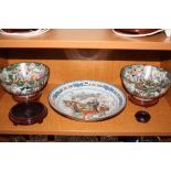 A PAIR OF CHINESE FAMILLE VERTE FOOTED BOWLS, figural panels surrounded by floral and insects