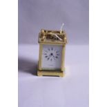 A BRASS CARRIAGE CLOCK (key)