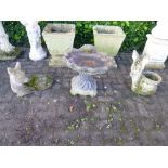 A COMPOSITE BIRD BATH, and two garden figures (3)