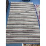 A HAND WOVEN INDIAN CARPET, with striped design, approximate size 300cm x 200cm