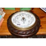 AN ANEROID BAROMETER, (glass cracked)