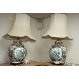 A PAIR OF CHINESE FAMILLE VERTE BULBOUS LAMP BASES AND SHADES, script, floral and insect details, on