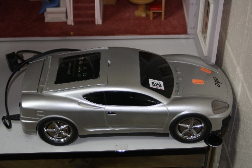 A NOVELTY SPORTS CAR SHAPED DVD PLAYER