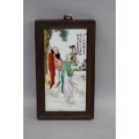 A CHINESE FRAMED PLAQUE, length approximately 28.5cm (includes frame)