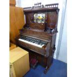 A BELL ORGAN & PIANO CO LTD, Gurlph Canada Organ with a mirrored and carved upper section,
