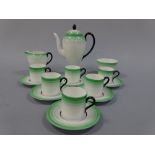 AN ART DECO STYLE WEDGWOOD COFFEE SERVICE FOR SIX, having graduated green tone banding, black