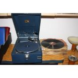 A VINTAGE HMV PICNIC GRAMOPHONE, in blue case, together with a collection of 78RPM records