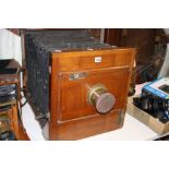 A LARGE MAHOGANY AND BRASS FULL PLATE STUDIO BELLOWS CAMERA, (no apparent makers mark), fitted