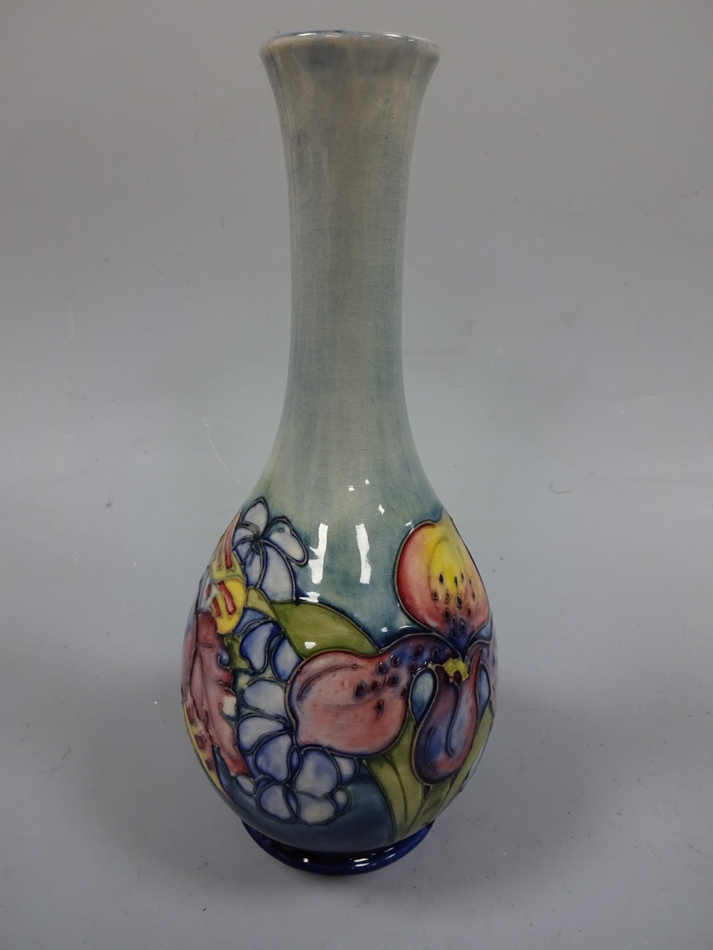 A MOORCROFT FOOTED BOTTLE VASE, with flared neck, tube line decorated with frilled orchid pattern to - Image 3 of 4
