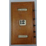 A 20TH CENTURY WALL MOUNTED OAK PERPETUAL CALENDAR, approximately 29.5cm x 10cm x 51cm