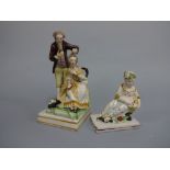 A STAFFORDSHIRE PEARLWARE FIGURE GROUP, modelled as Hairdresser attending lady's hair set on