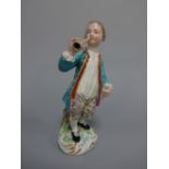 AN 18TH CENTURY DERBY FIGURE, modelled as boy playing horn, on naturalistic base with gilt scroll