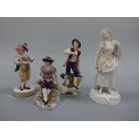 FOUR CONTINENTAL FIGURINES, gent with grapes and vine, approximately 18cm high, gent with basket