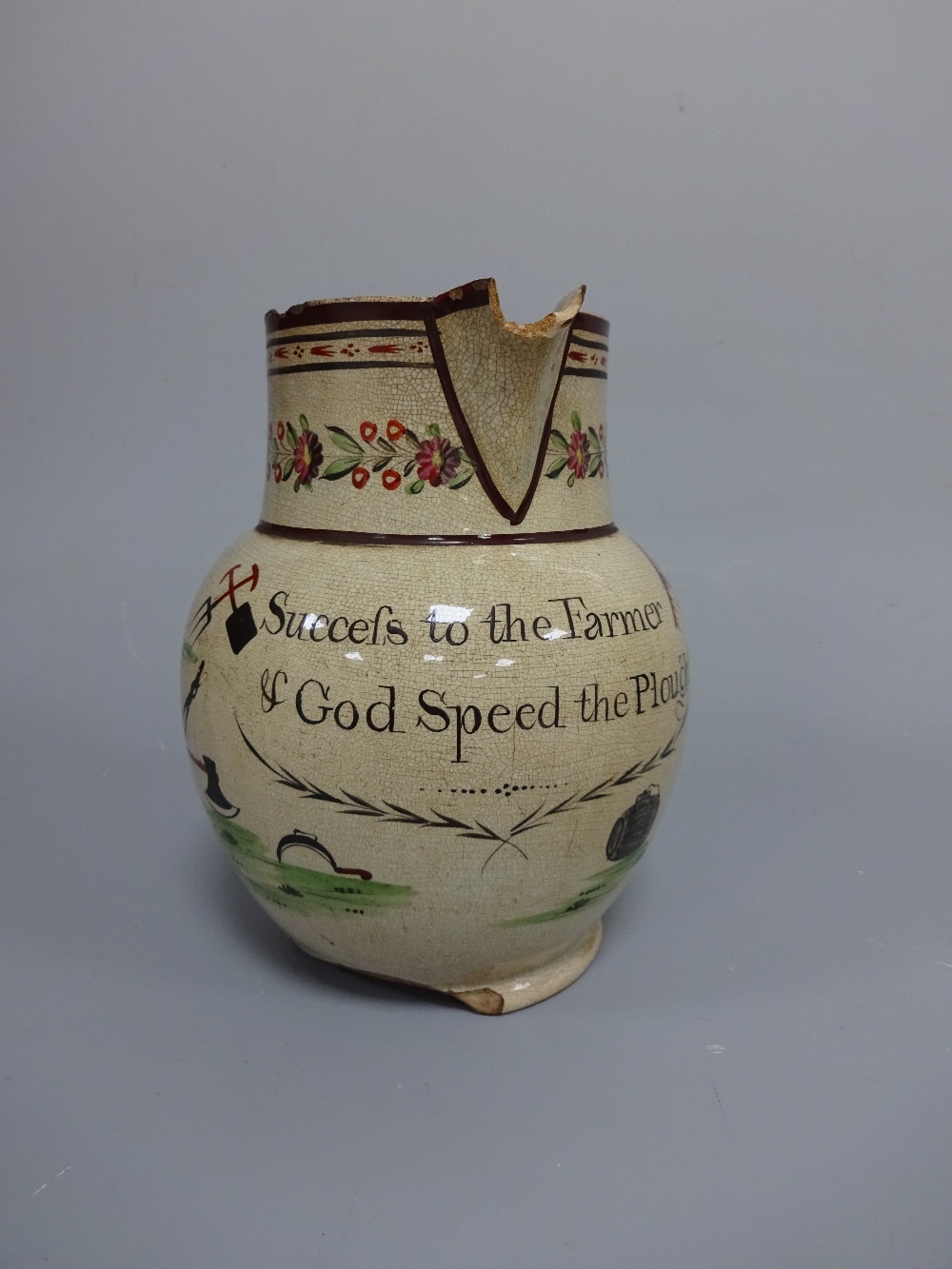 A 19TH CENTURY PEARLWARE JUG, inscribed Succefs to the Farmer & God Speed the Plough and decorated