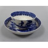 A WORCESTER BLUE AND WHITE TEA BOWL, decorated with figure fishing and landscapes, saucer