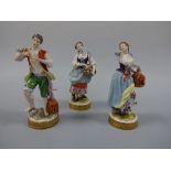 THE VOLKSTEDT FIGURES, flower seller with impressed V20674 to base and lady and gent with birds
